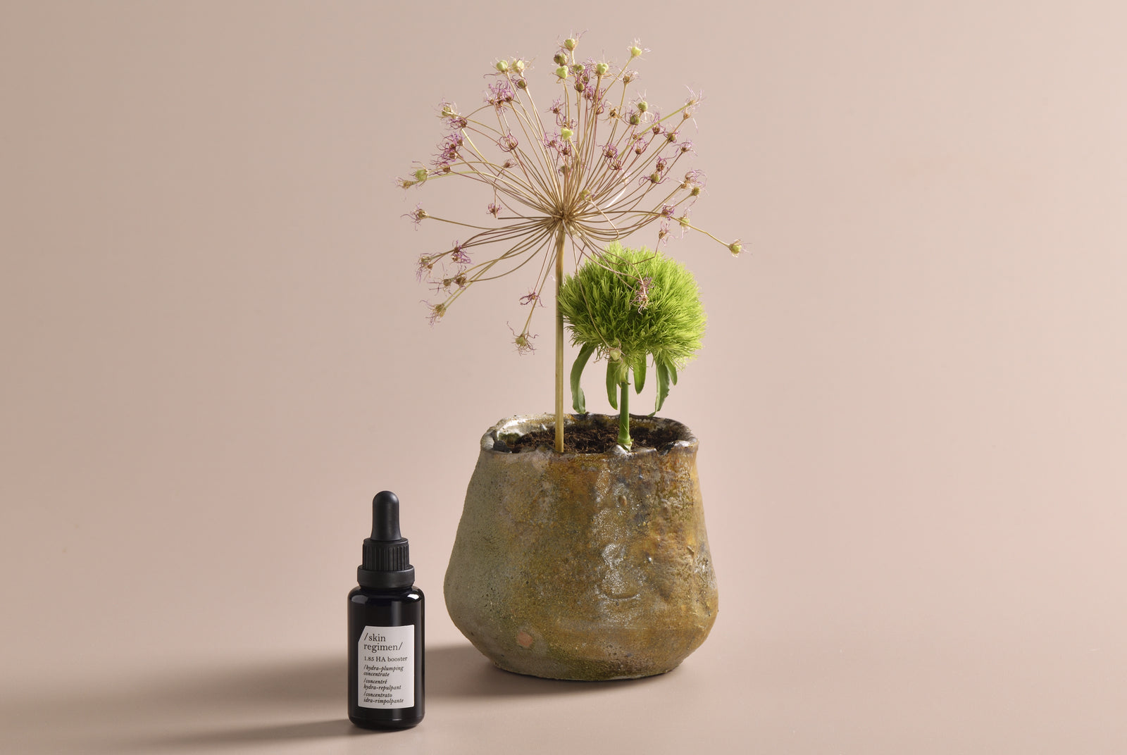 skin regimen 1.85 hyaluronic acid booster on a light pink background