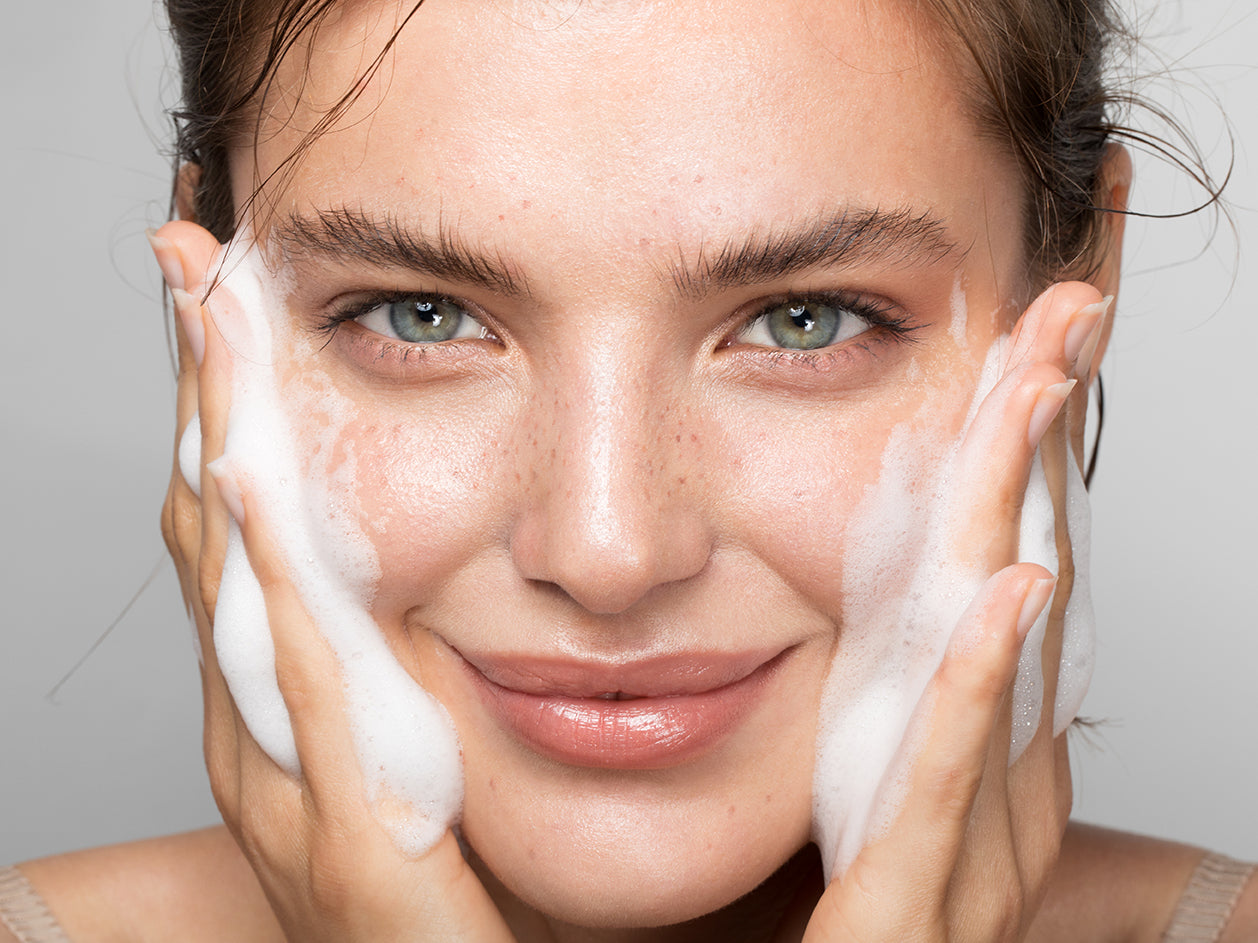 Woman washing her face 